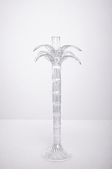 Clear palm tree-shaped candle holder on a white background