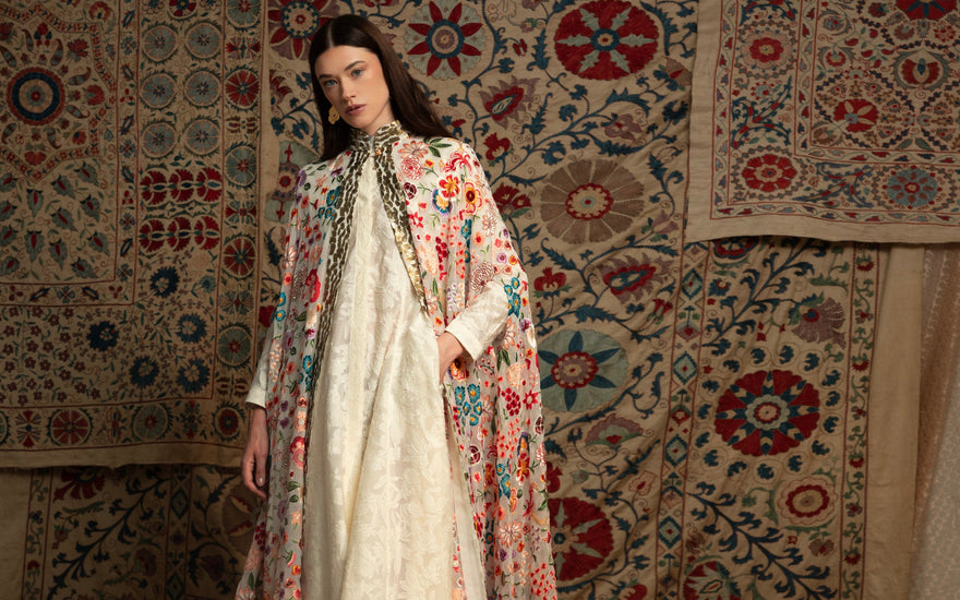 a woman is standing in a background in a studio