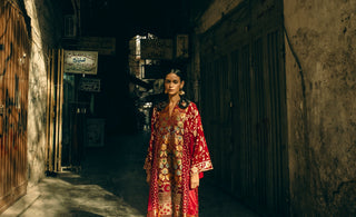 a woman is standing in a background in a studio