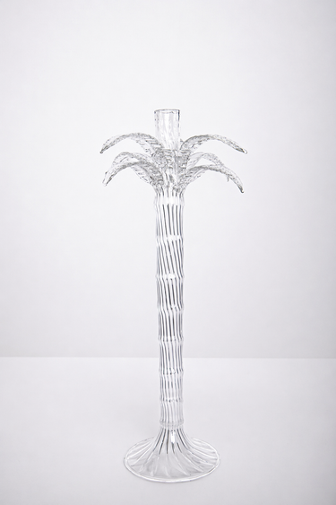 Clear palm tree-shaped candle holder on a white background