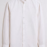 White button-up shirt on a light gray background